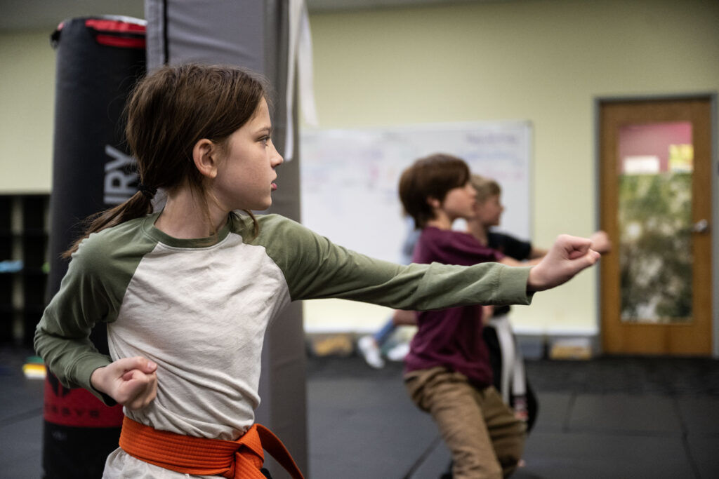 Seventh grader Lucas DeWitt practicing martial arts at school