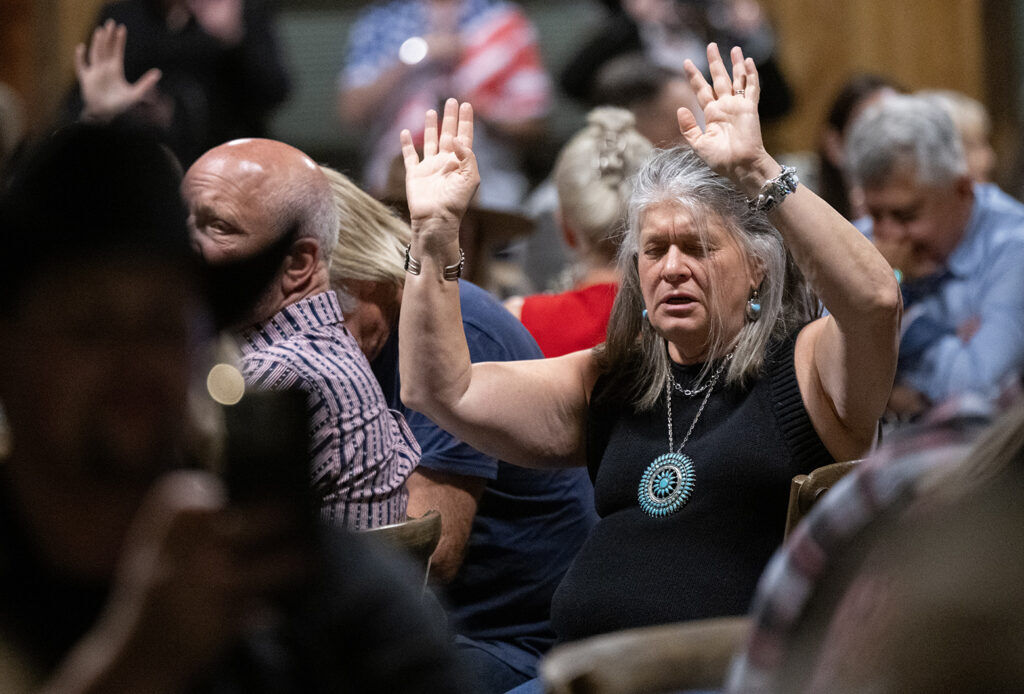 Supporters pray for their candidate Victor Marx in a close race for the Republican governor candidate Tuesday, June 30, 2026, during a Colorado Primary Election watch party at Spruce Mountain Ranch in Larkspur, Colo. (The Gazette, Christian Murdock)