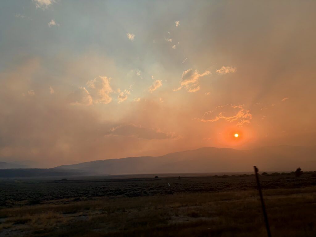 Smoke from the Willow Fire near Leadville with a red sun shining through.