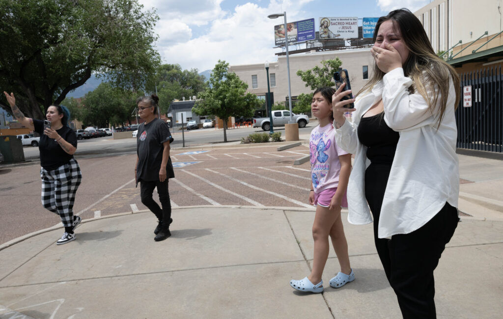 Inez, the daughter of detainee Sergio, reacts as she and other family members watch Thursday, July 9, after a van carrying detainees leaves the ICE holding facility in downtown Colorado Springs for the immigration detention center in Aurora. (Christian Murdock, The Gazette)
