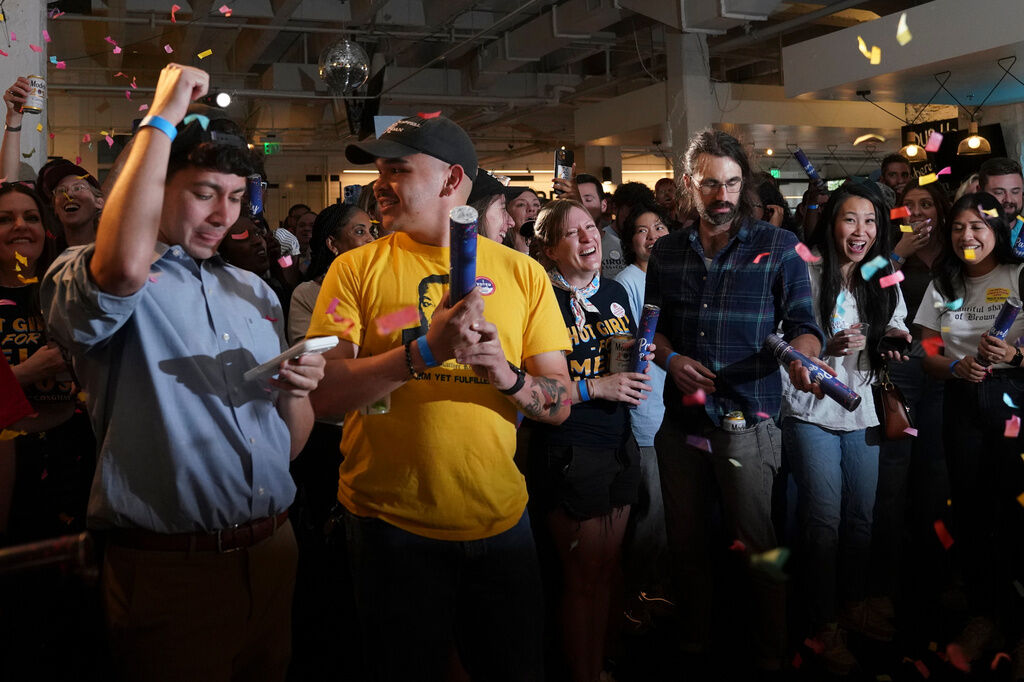 Supporters of Democratic congressional candidate Melat Kiros cheer after the first report of the election results show Kiros in the lead during a primary election night watch party at The Broadway, Tuesday, June 30, 2026, in Denver. (AP Photo/Rebecca Slezak)