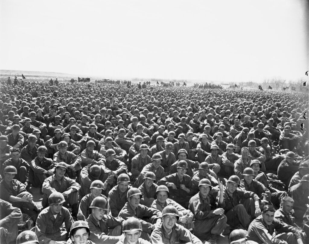 
Here is a portion of the more than 12,000 Camp Carson troops who watched the air-ground war exercises at the camp on Saturday. Units shown here are the 196th Infantry, the 3-3th Engineer Group, the 14th Regiment Combat Team, the Provisional Artillery and the 5022nd Army Service Unit. Photo appeared in the Colorado Springs Gazette Telegraph on May 6, 1951, page A8. (Courtesy of Pikes Peak Library District)