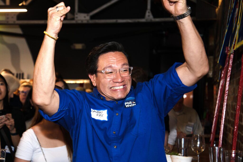 Phil Weiser supporter Lazarus Pax cheers as early results show a lead for Weiser in the Democratic primary for Colorado's next governor at a watch party on Tuesday, June 30, 2026 in Denver, Colo. (Tom Hellauer/Denver Gazette)