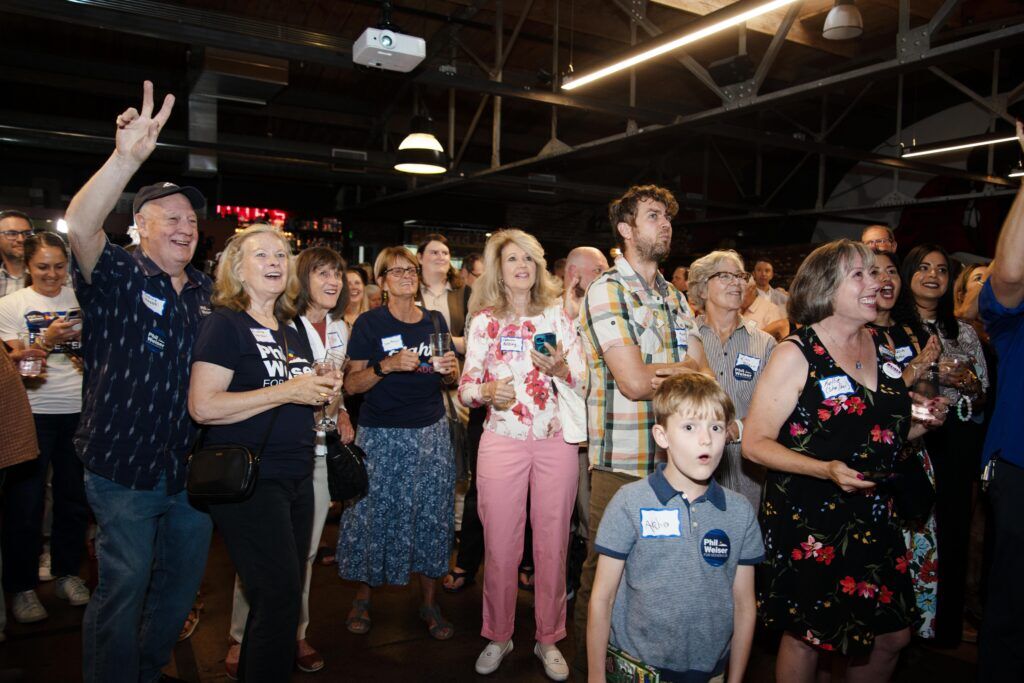 Phil Weiser supporters cheer at his election night watch party after initial results in the Democratic primary for Colorado's next governor are released Tuesday, June 30, 2026 in Denver, Colo. (Tom Hellauer/Denver Gazette)