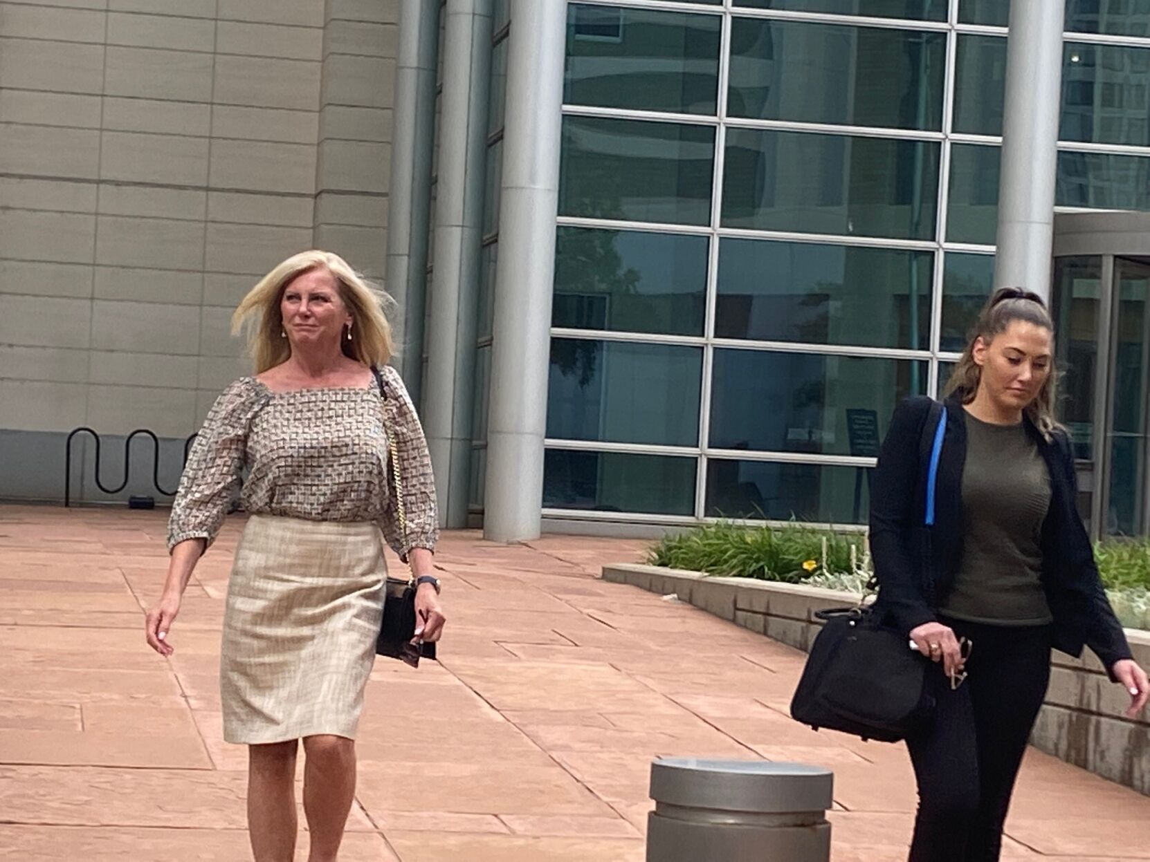 Lori Milliron leaves Denver's federal courthouse after trial Wednesday. Milliron is on trial for lying to a grand jury about her relationship with Larry Rudolph