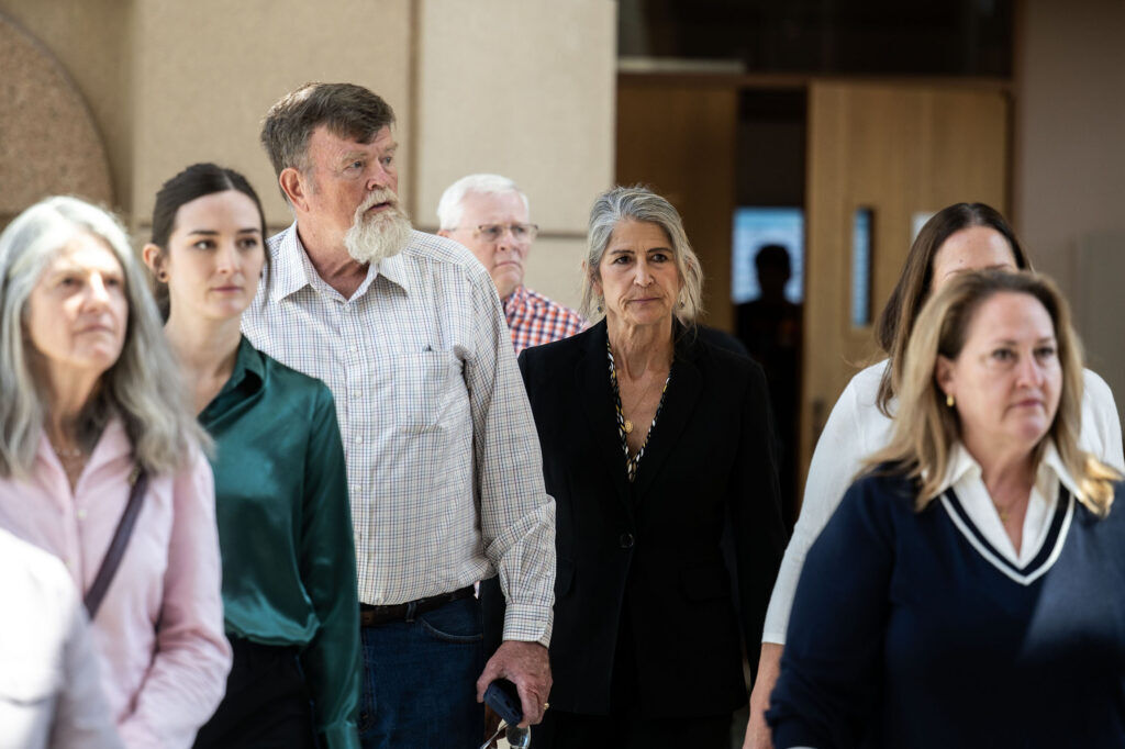 Missy Woods leaves the Jefferson County Courthouse with her friends and family after pleading guilty to 4 counts