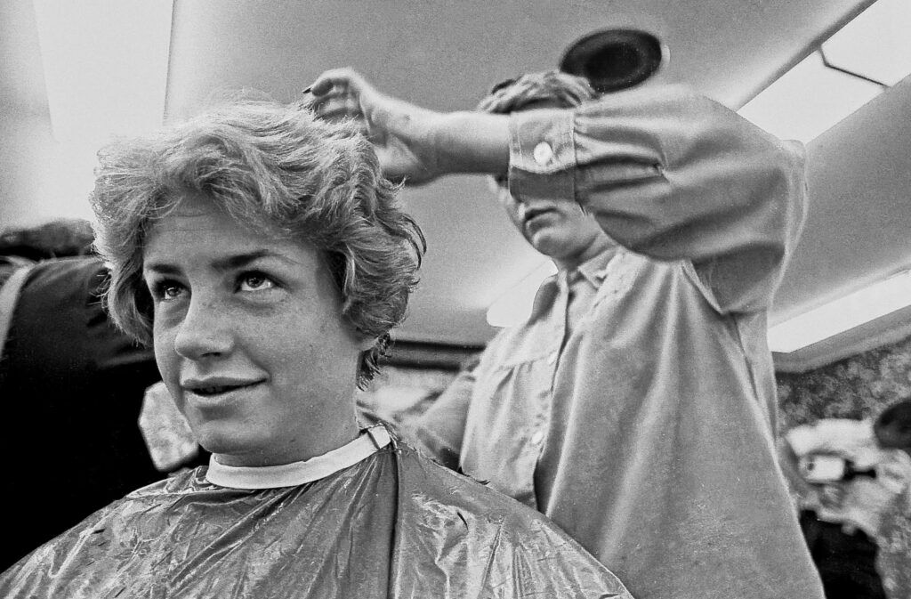 Air Force Academy cadet Jane Chandler has her hair cut as part of her admission to the Air Force Academy in 1976. All the ladies were required to get short haircuts. Today women can keep their long hair as long as it is appropriately styled. Photo by Ed Lallo, Getty Images