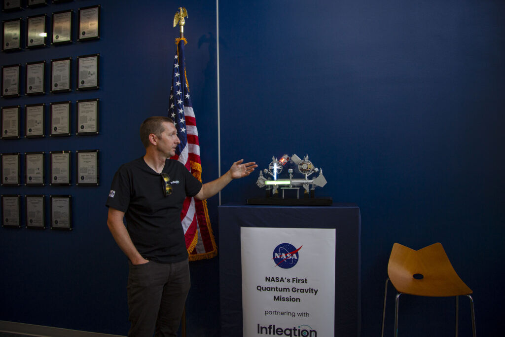 An Infleqtion worker showcases a quantum gravity sensor at the company's headquarters in Louisville, Colo. on Aug. 18, 2026. (Bernadette Berdychowski / The Denver Gazette)