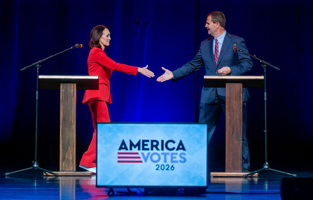 Jessica Killin, Democratic candidate for the 5th Congressional District, and incumbent U.S. Rep. Jeff Crank, a Republican, shake hands before a debate sponsored The Gazette, Colorado Politics and KOAA and El Pomar Foundation at the Pikes Peak Center on Thursday. (Jerilee Bennett, The Gazette)