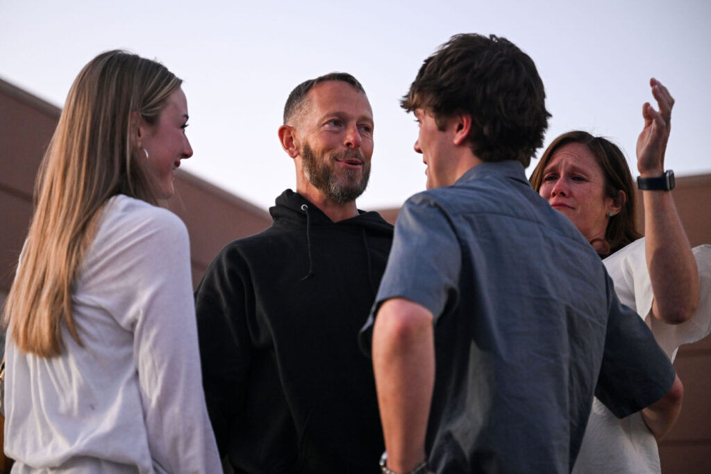 FILE PHOTO: Michael Clark hugs his family outside the Boulder County Jail on Monday, April 14, 2025. A judge overturned his conviction in a 1994 Boulder murder case on Friday because of flawed DNA testing. (Stephen Swofford/Denver Gazette)