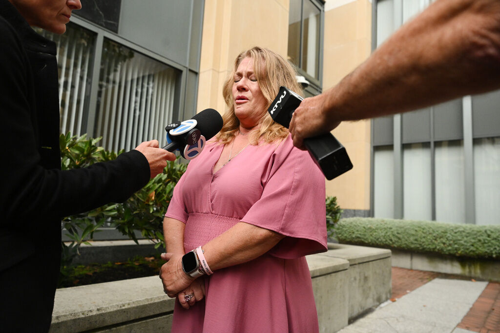 Victoria Hinks gets emotional after talking about her daughter with the media outside court after tech giant Meta reached a settlement to end a landmark trial over teen social media addiction on Wednesday, Aug. 26, 2026, in Oakland, Calif. (Noah Berger, The Associated Press)