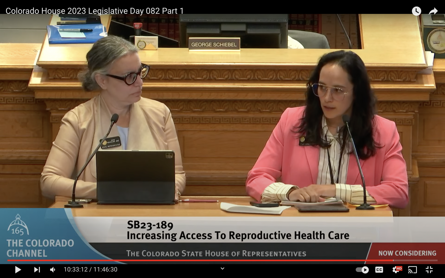 Rep. Dafna Michaelson Jenet (left) and Rep. Lorena Garcia (right) discuss their bill Senate Bill 189, to require health insurance carriers that serve large employers to pay for abortion coverage, on the House floor on Friday, March 31, 2023.