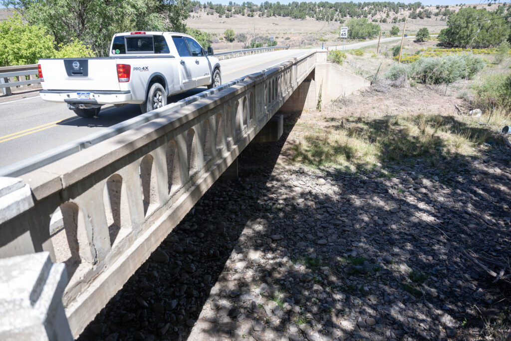 A car drives over the dried Cucharas River outside of La Veta near the Wahatoya Reservoir in La Veta.
