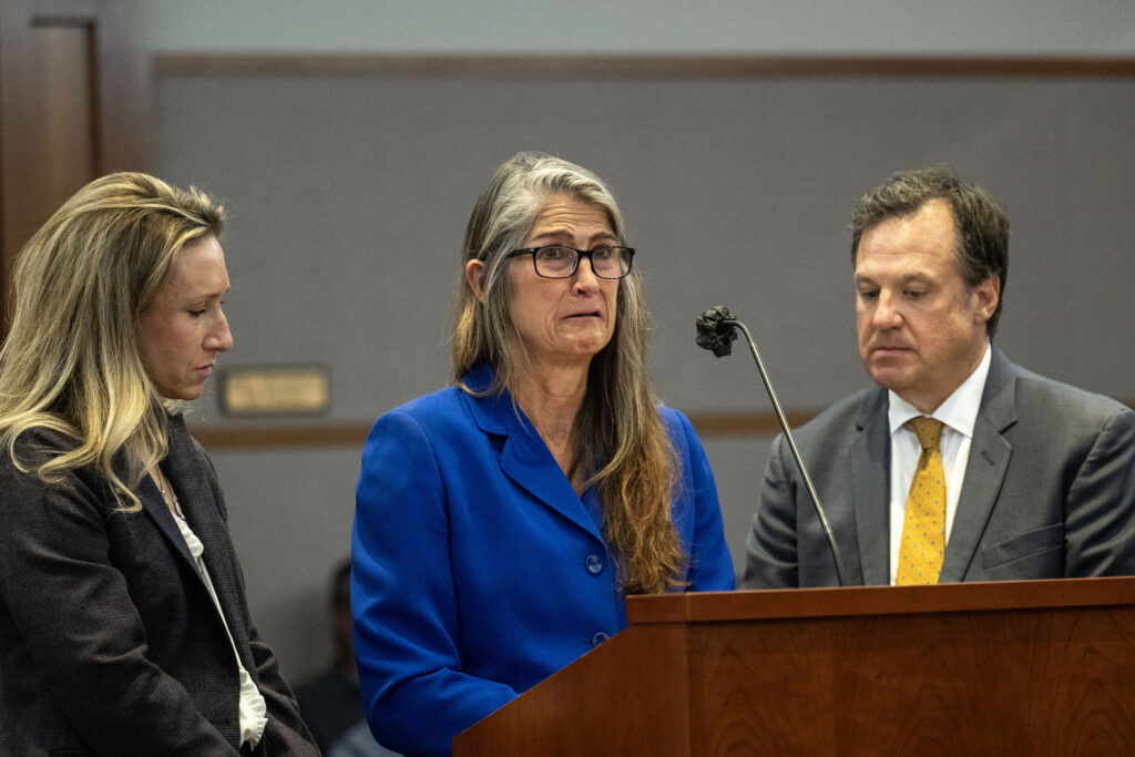 Missy Woods, center, cries as she gives a personal statement while surrounded by her lawyers Lindsay Brown, left, and Tom Ward, during a sentencing hearing at the Jefferson County Courthouse on Tuesday, Sept. 8, 2026. Woods was sentenced to serve 10 years for cybercrimes and two 6 year sentences to be served concurrently for other crimes she pled guilty to.