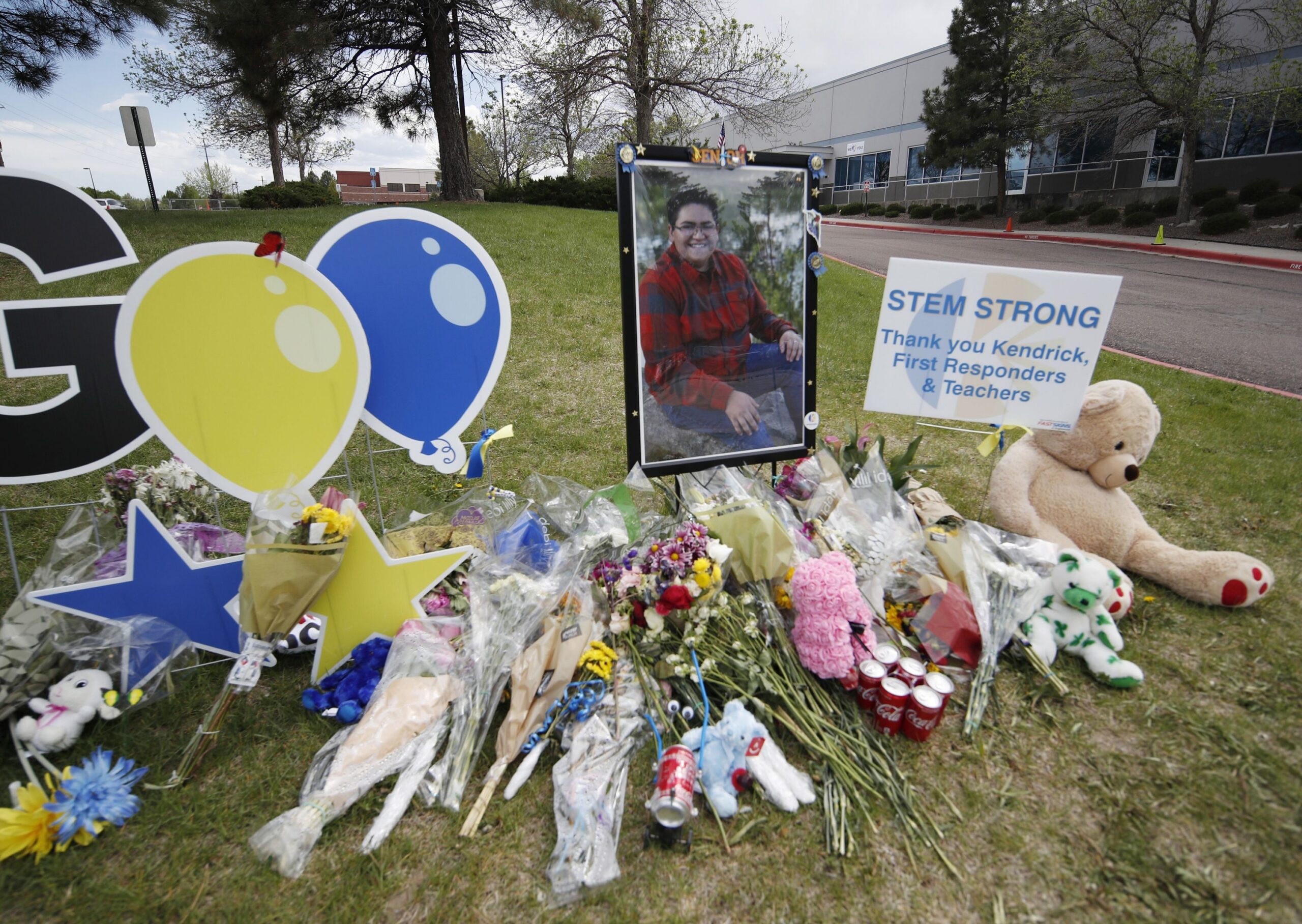 A display grows outside the STEM School Highlands Ranch a week after the attack on the school that left one student dead and others injured, May 14. Student Kendrick Castillo pictured in the display was was fatally wounded in the May 7 shooting. (AP Photo/David Zalubowski)